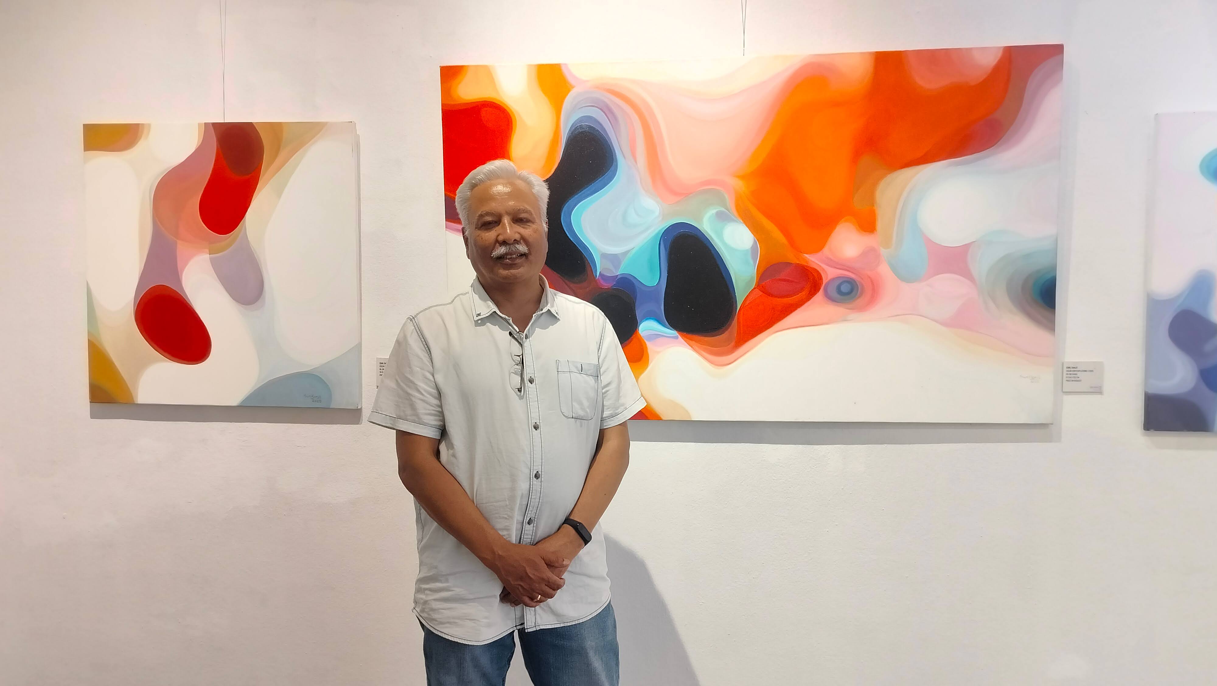 Artist Sunil Ranjit infront of his painting at Nepal Art Council, Babermahal.