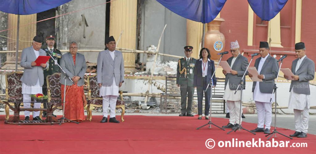 Three new ministers sworn in outside ruined Sheetal Niwas