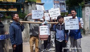 NSU demonstrates in front of Ghantaghar carrying empty gas cylinders