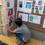 Bibek, 12, is taping hope to a hospital wall