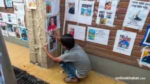 Bibek, 12, is taping hope to a hospital wall