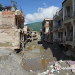 Who defines reconstruction after the Bhotekoshi flood?